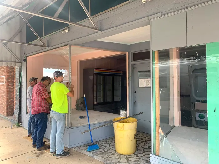 Workers renovating the storefront