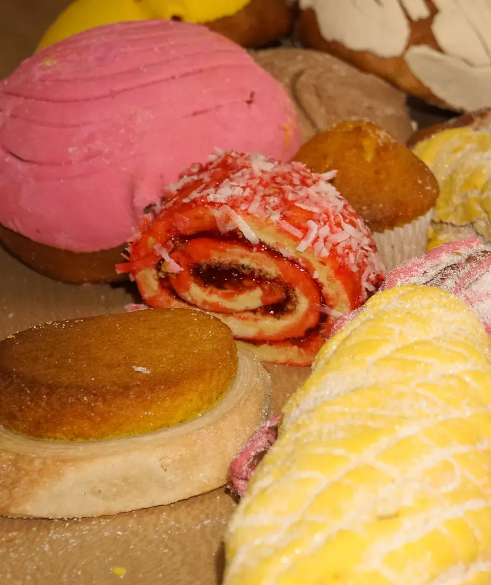 Conchas, a coconut roll, elote and cinnamon rolls fresh from the oven