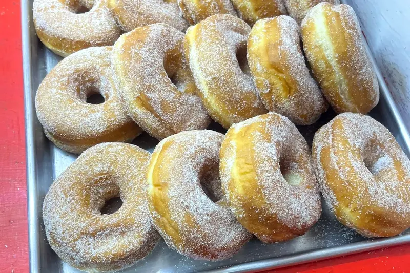 Sugar doughnuts on a tray
